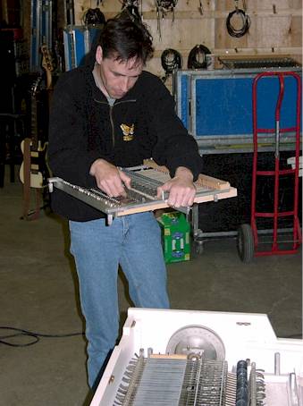 Pierre inspecting a keyboard